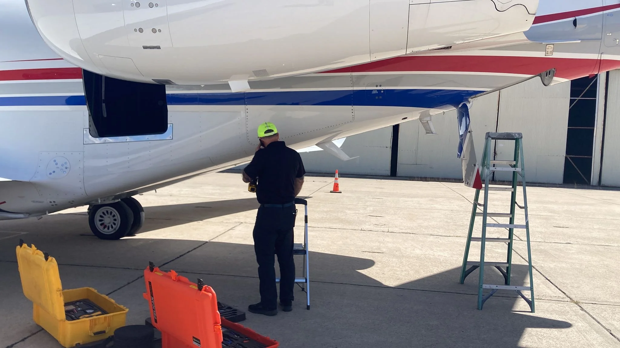 Don Jones on ramp with Gulfstream and equipment