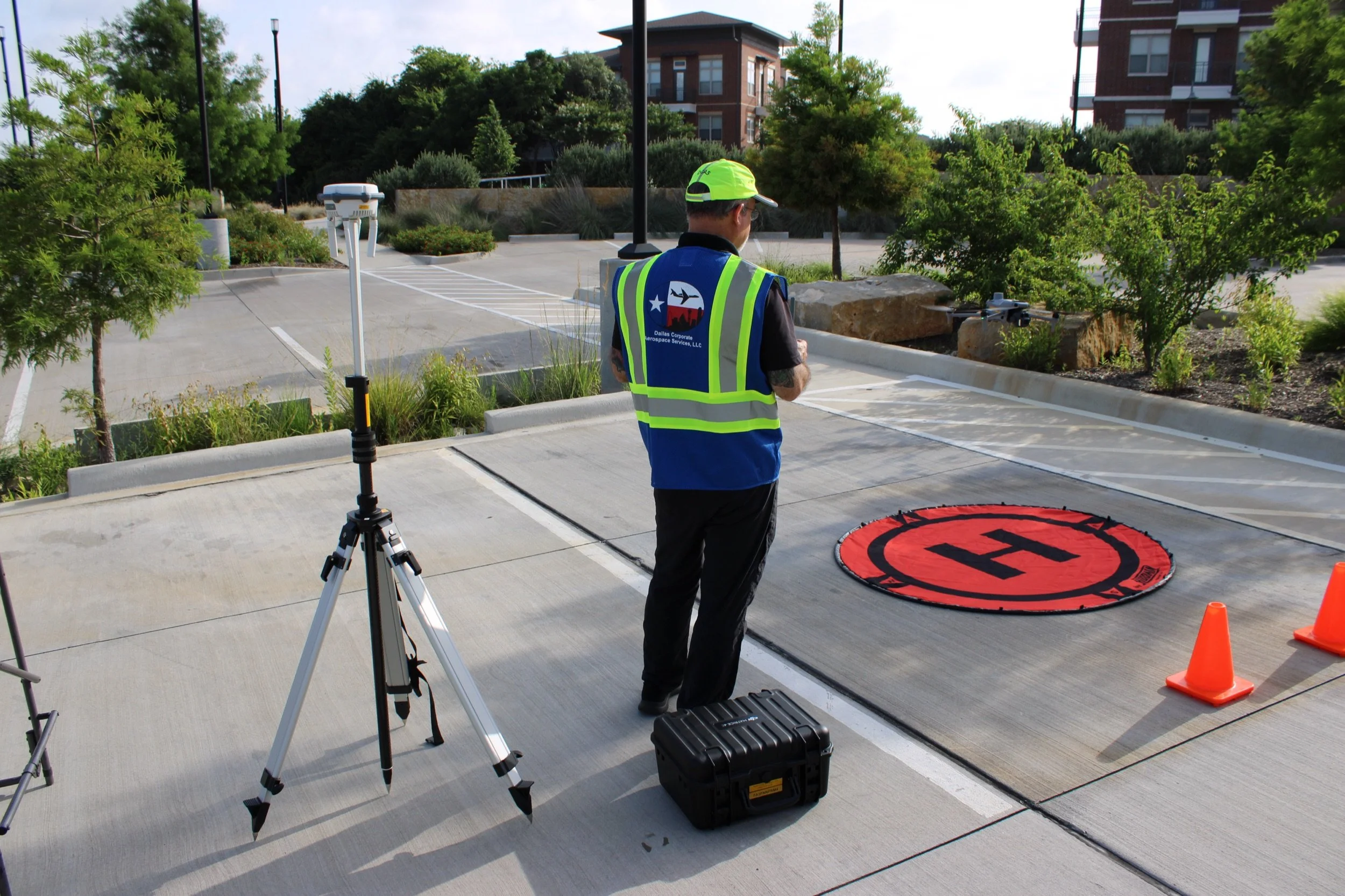 Don Jones operating a DCAS drone alongside RTK ground station equipment during a survey