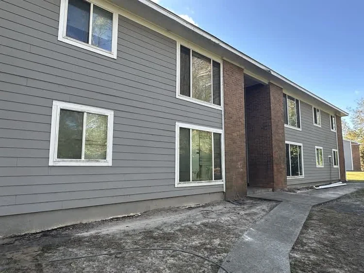 Clean two-story apartment building exterior, Statesboro area