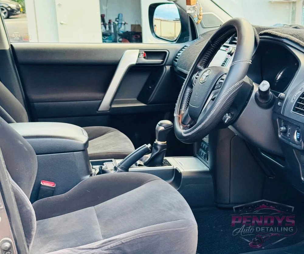 Toyota Prado fabric front seat, floor mat and dashboard after detailing