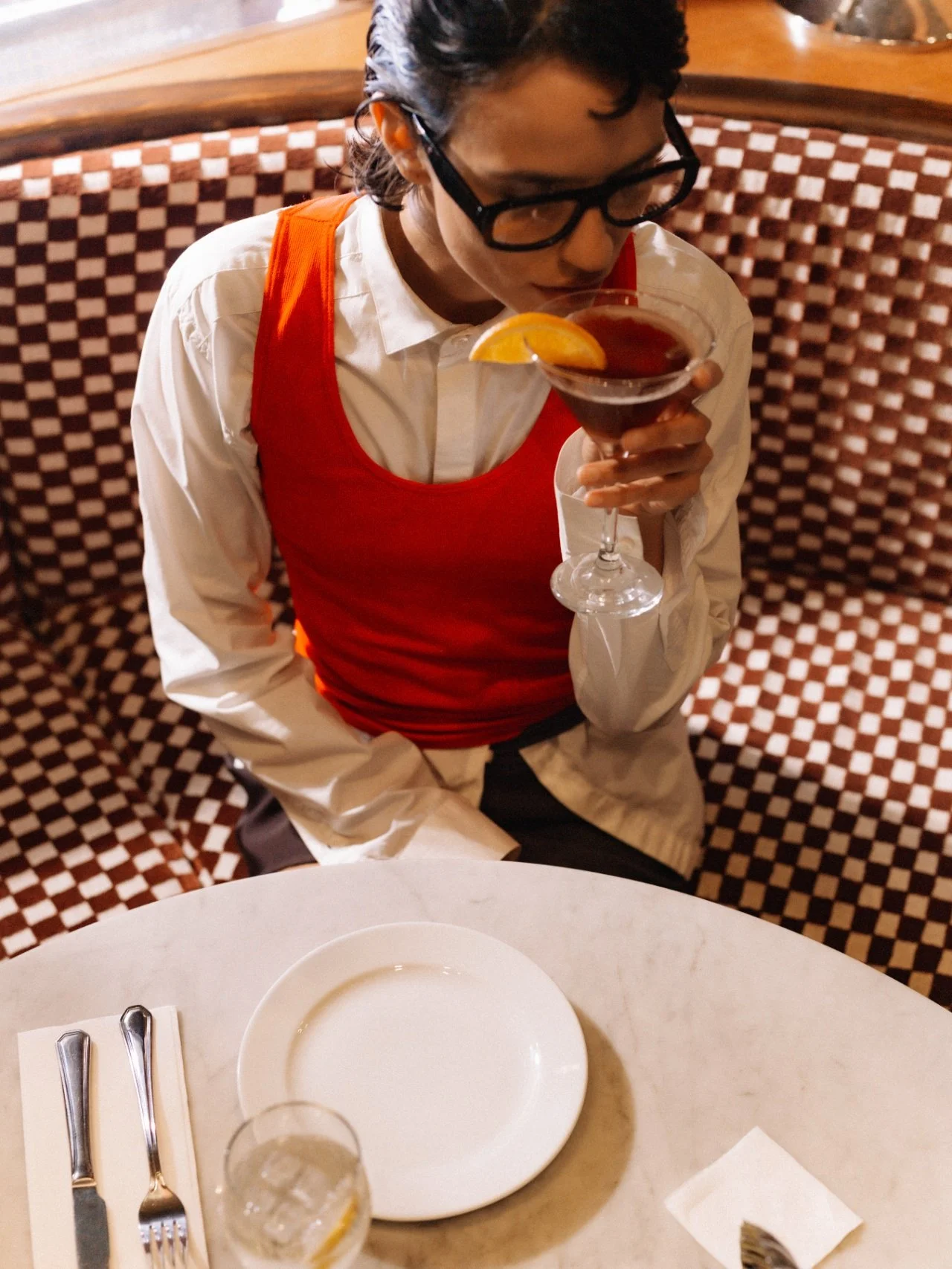Man in optical frames at a cafe