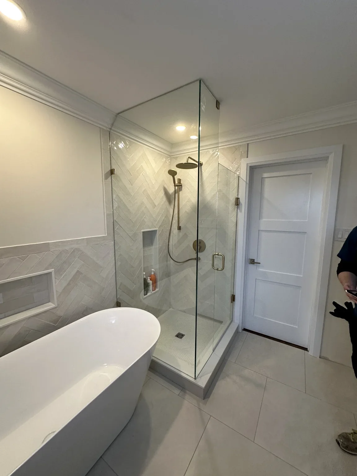 Completed bathroom renovation in Oakville with custom shower, freestanding tub and heated tile floor