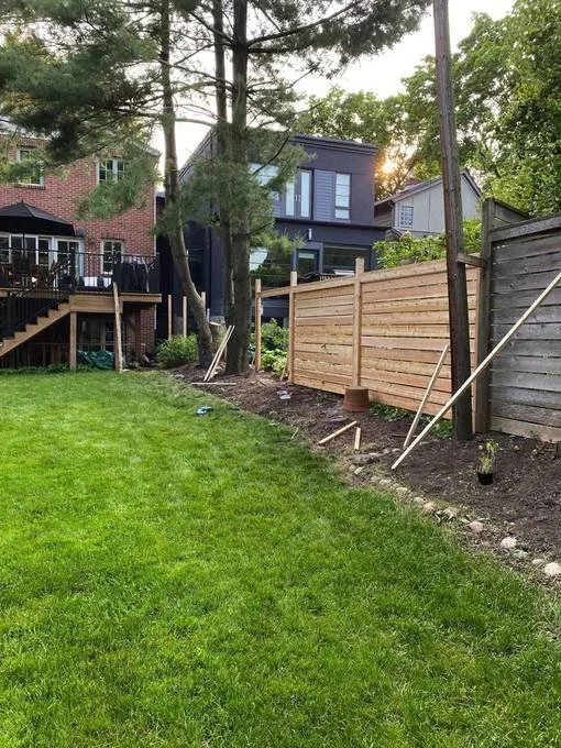 Fence posts and horizontal boards installation in progress