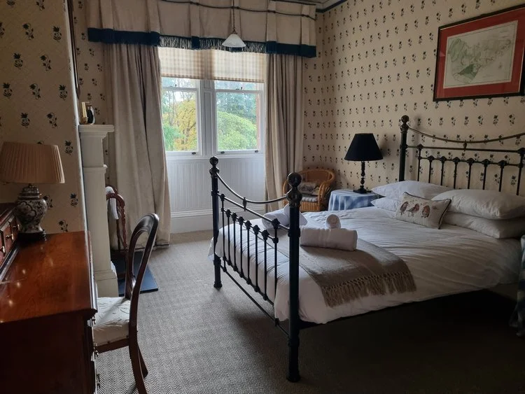 A light filled double bedroom at Dungarthill House