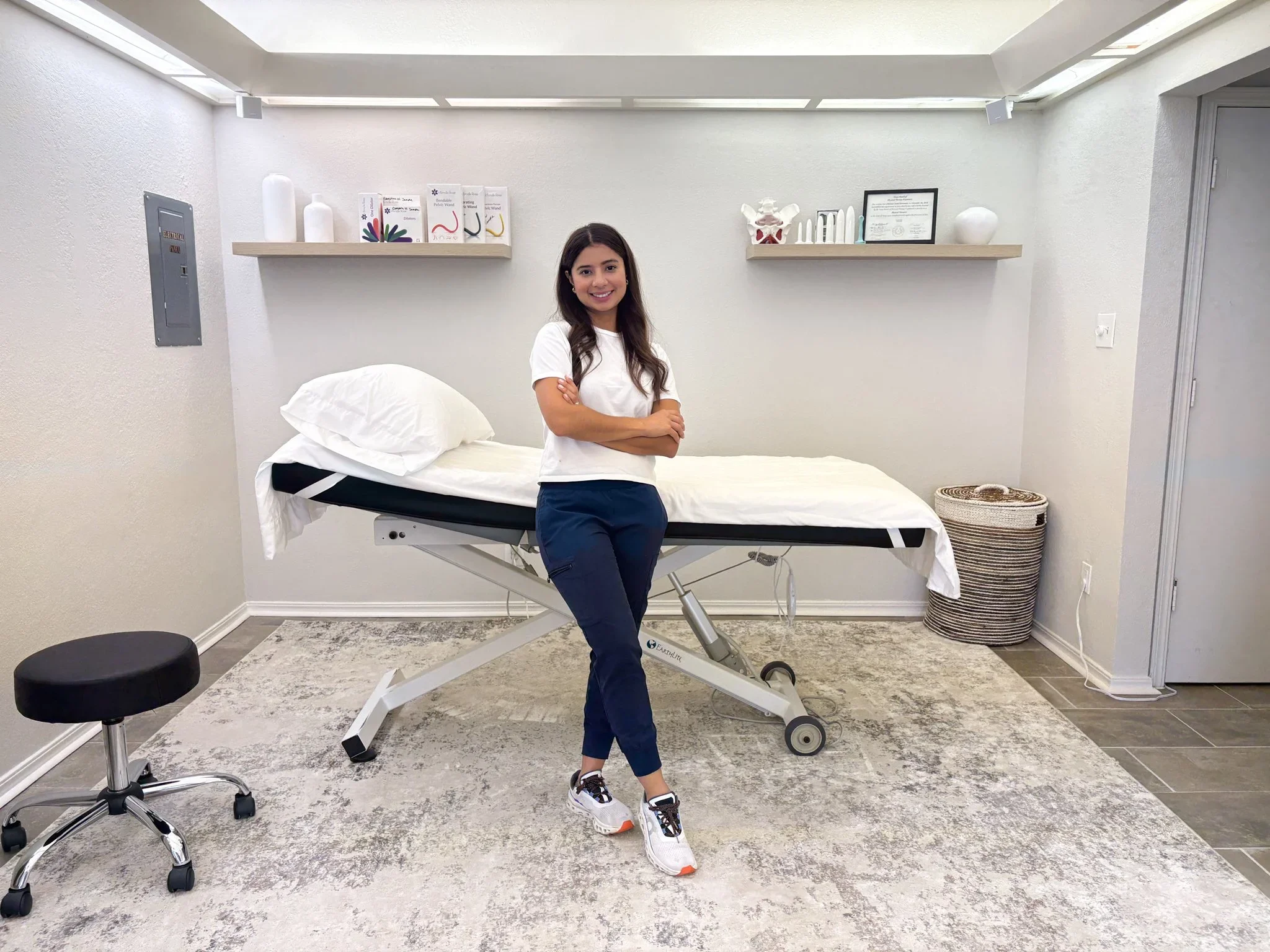 Christine Hernandez, PT, DPT, standing in the private treatment room at The Pelvic Lab