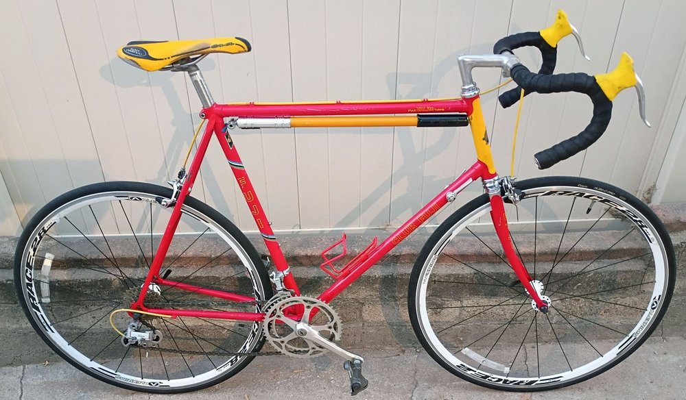 A red and yellow Fuji road bike