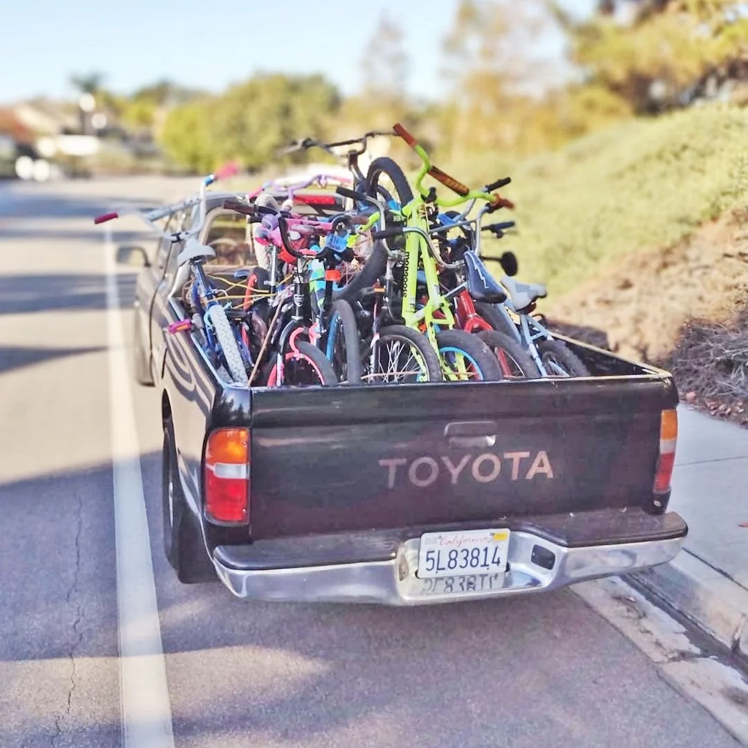 A pickup truck loaded with donated bikes