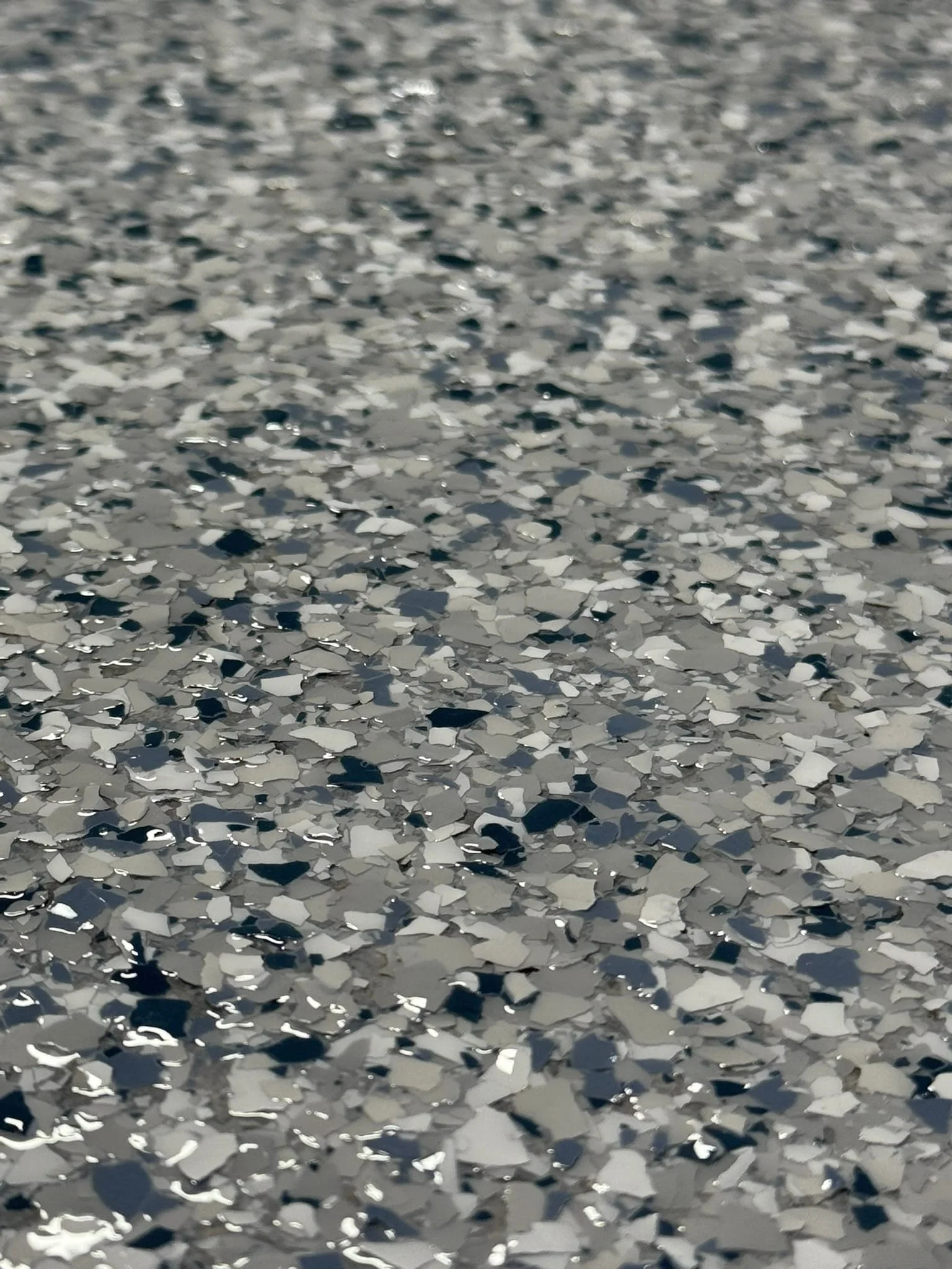 Close-up of gray white and black decorative floor flakes
