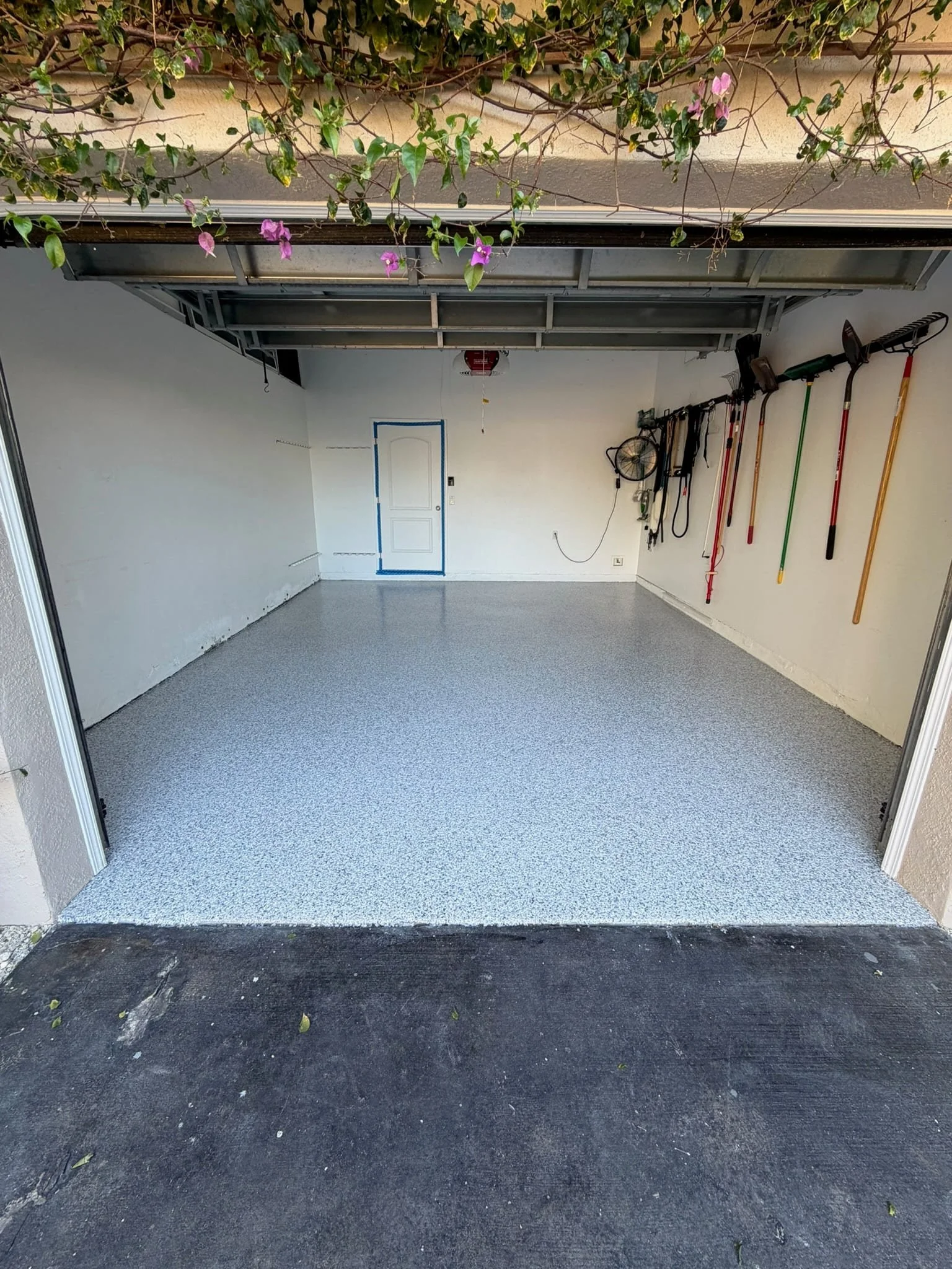 Light gray garage floor viewed from the driveway
