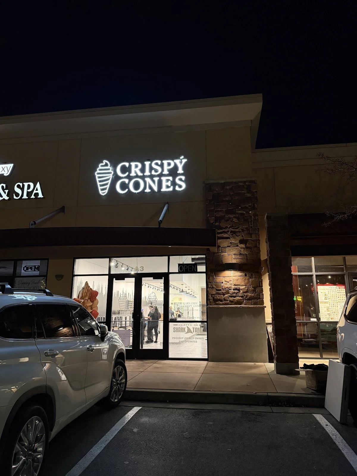 Crispy Cones storefront in Draper, Utah, lit up at night