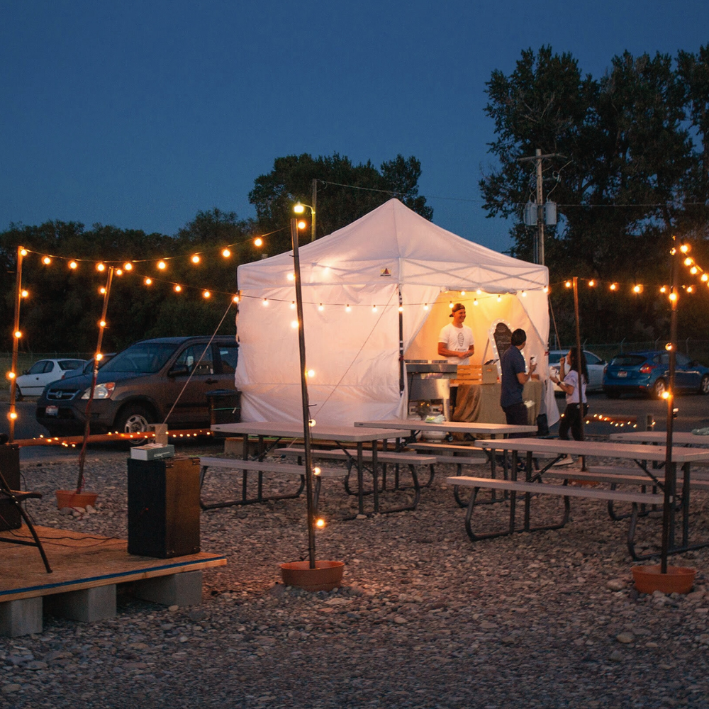 The original Crispy Cones tent lit up at night in Rexburg, Idaho
