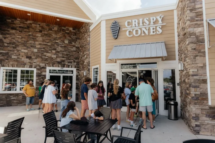 Guests lined up outside a Crispy Cones grand opening