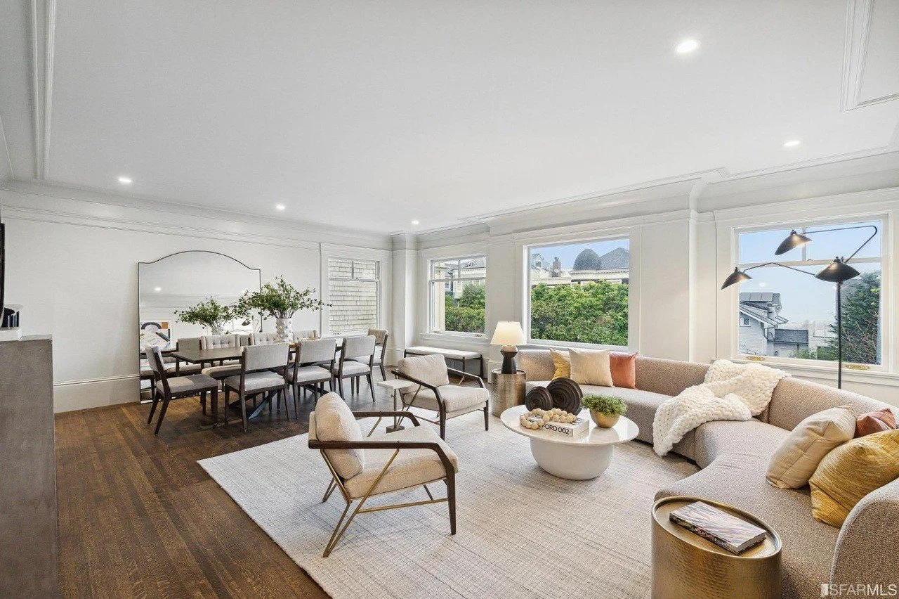 Connected living and dining spaces with classic trim