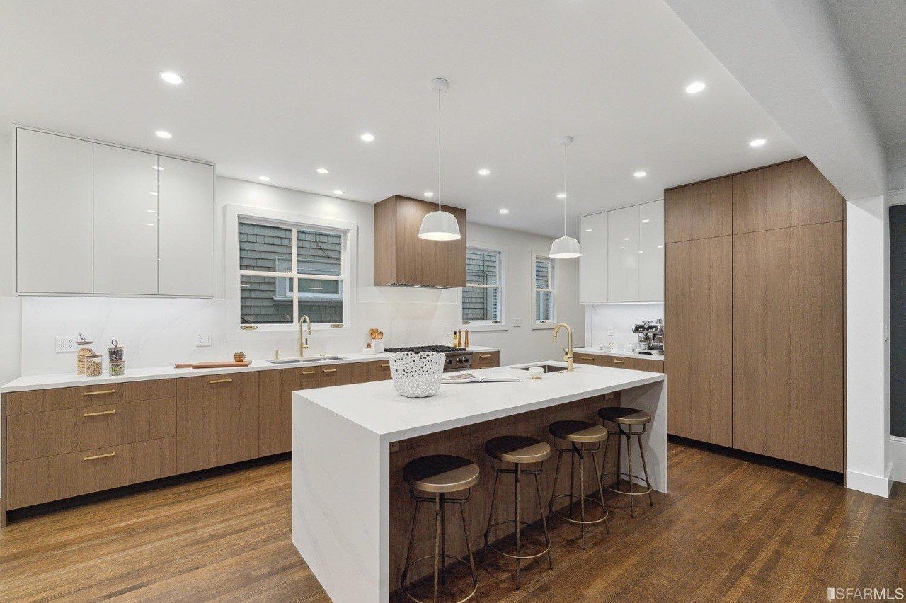 Warm wood cabinetry and a generous stone island