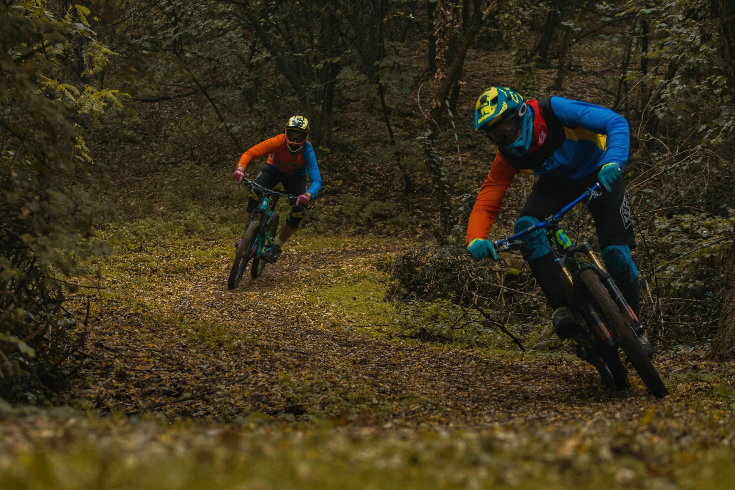 mountain bikers riding a low impact rake and ride trail
