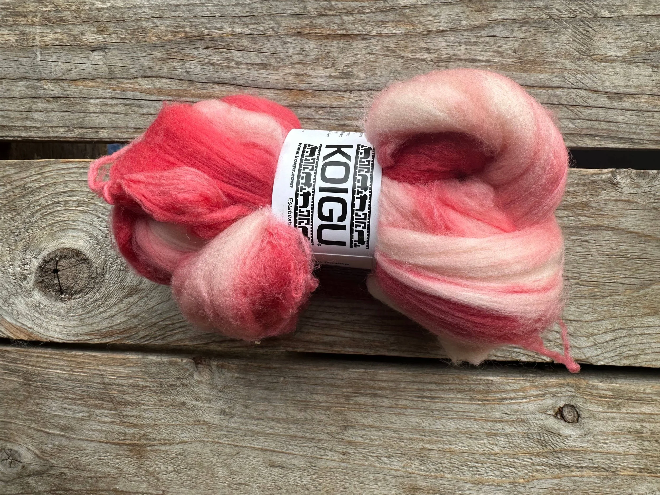 Koigu felting fiber bundle in pink to red gradient