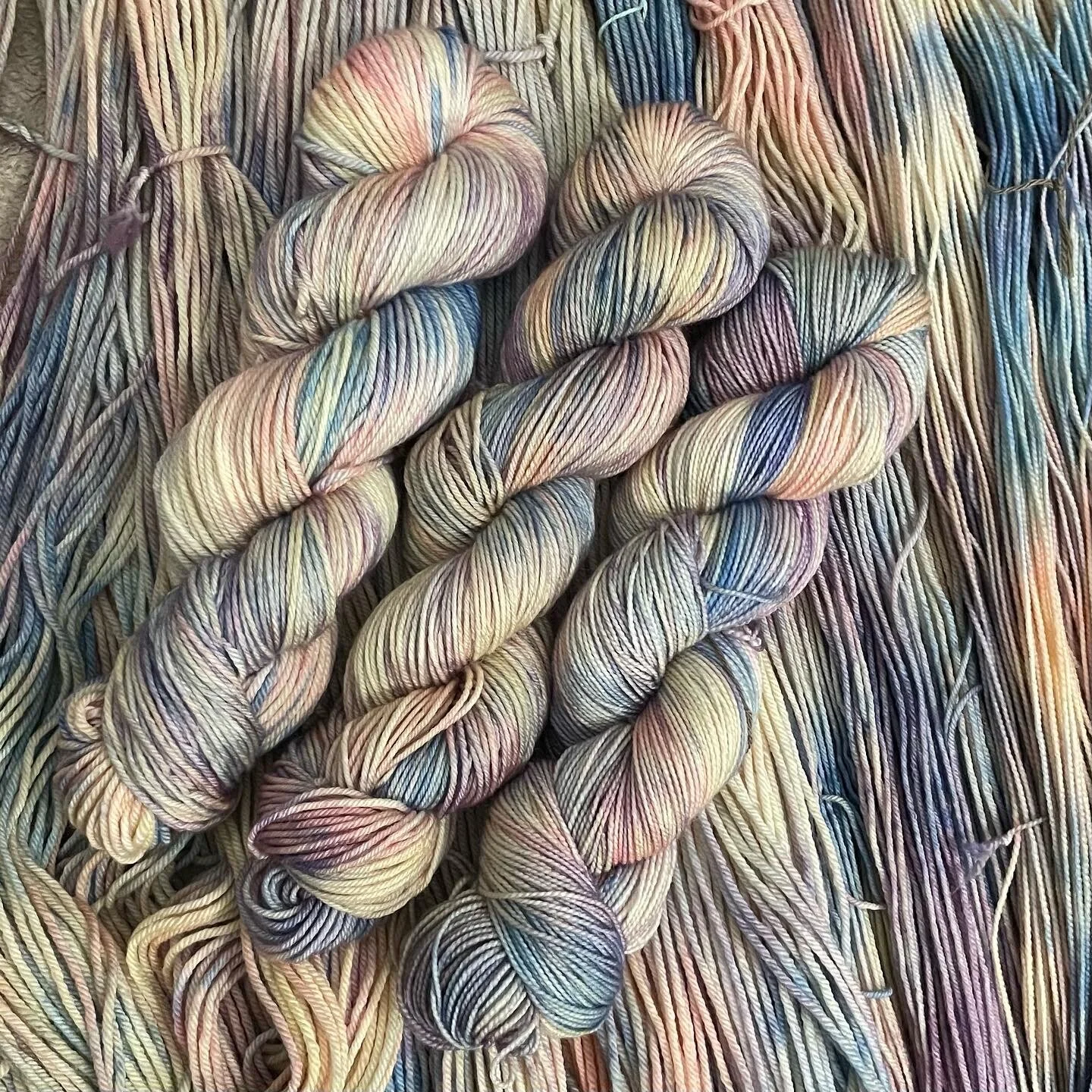 Portobello Bulky yarn hanks in a pastel multicolor palette for quick cozy projects.