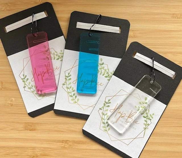 HapBee acrylic ruler stitch-marker combo in clear pink and blue on display card