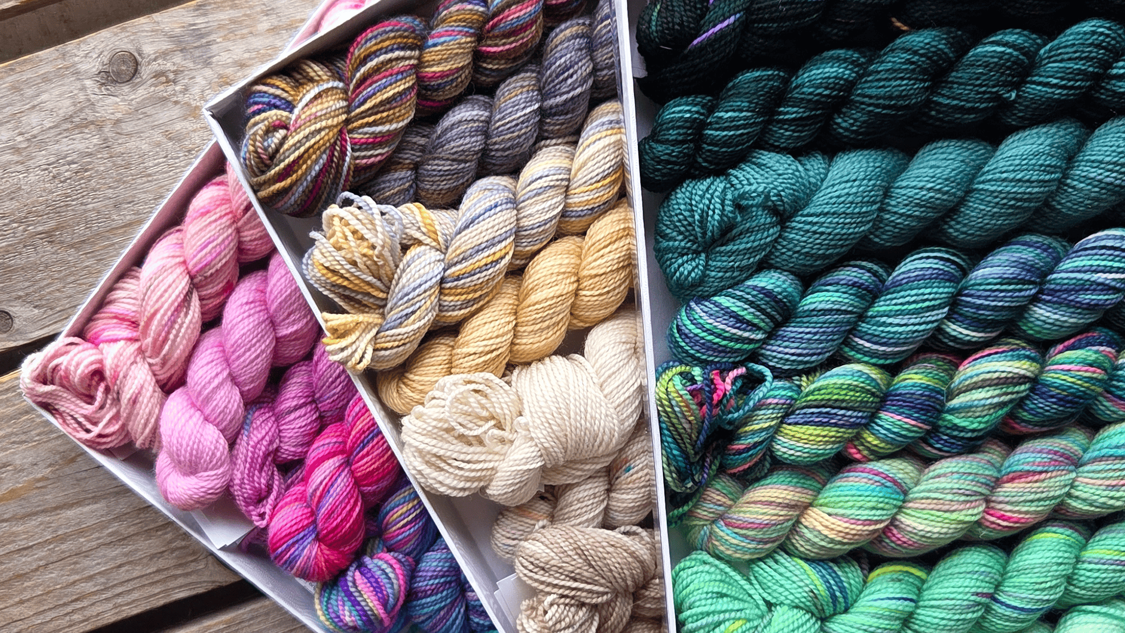 Vibrant yarn storage cubies display at AriYARN showing curated natural fibers.