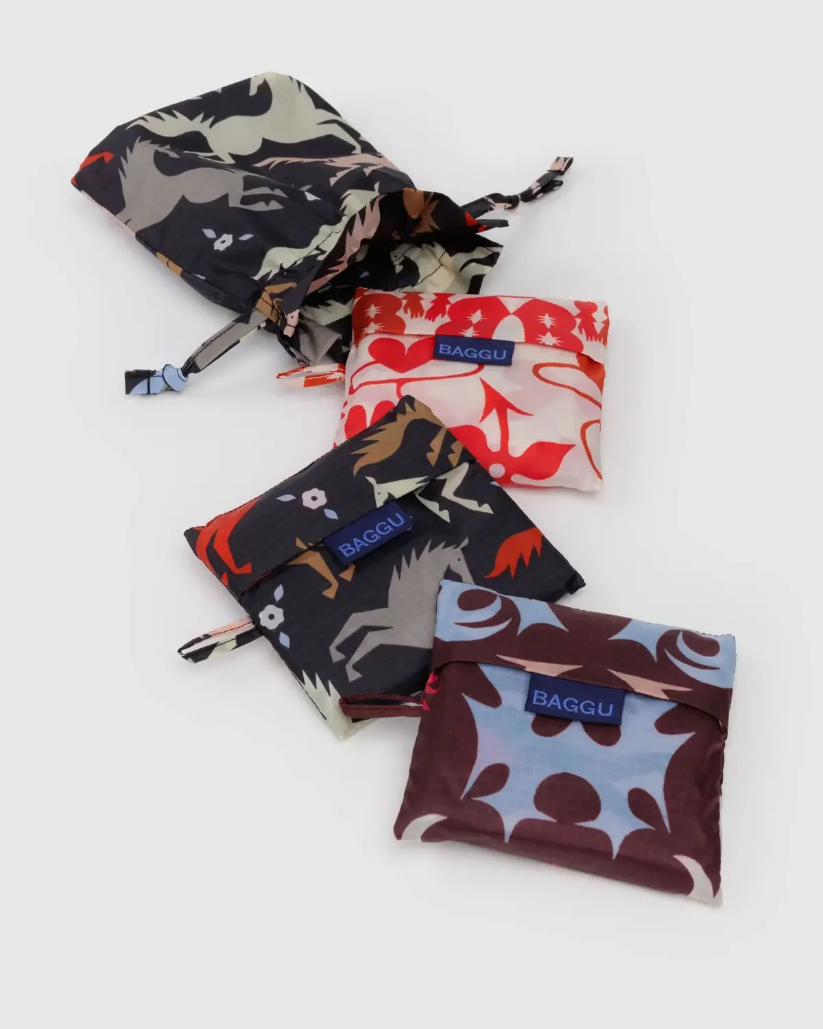 Reusable bag set with animal print patterns displayed as a colorful product photo
