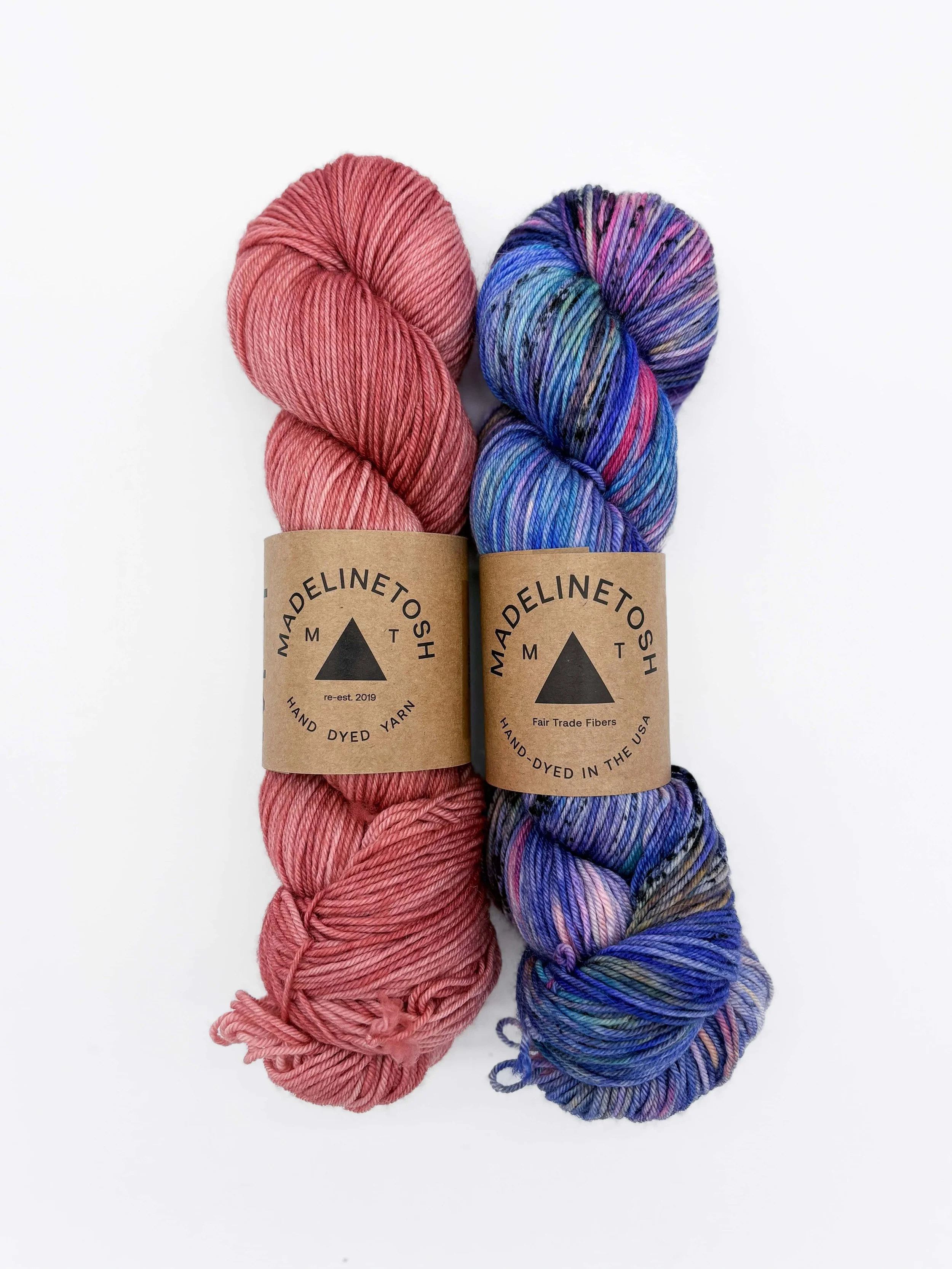 Madelinetosh-style shawl kit yarn in pink and blue tones on display at AriYARN Shop & Studio