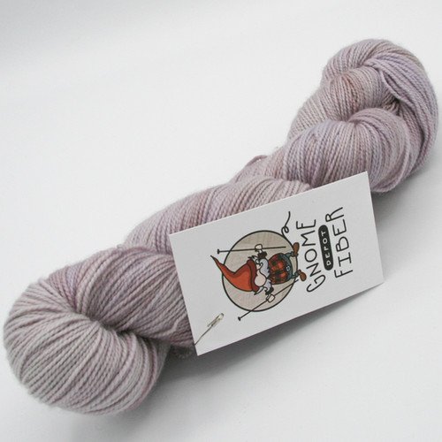 Gnome Depot DK-weight yarn skein in a light purple/lavender tone.