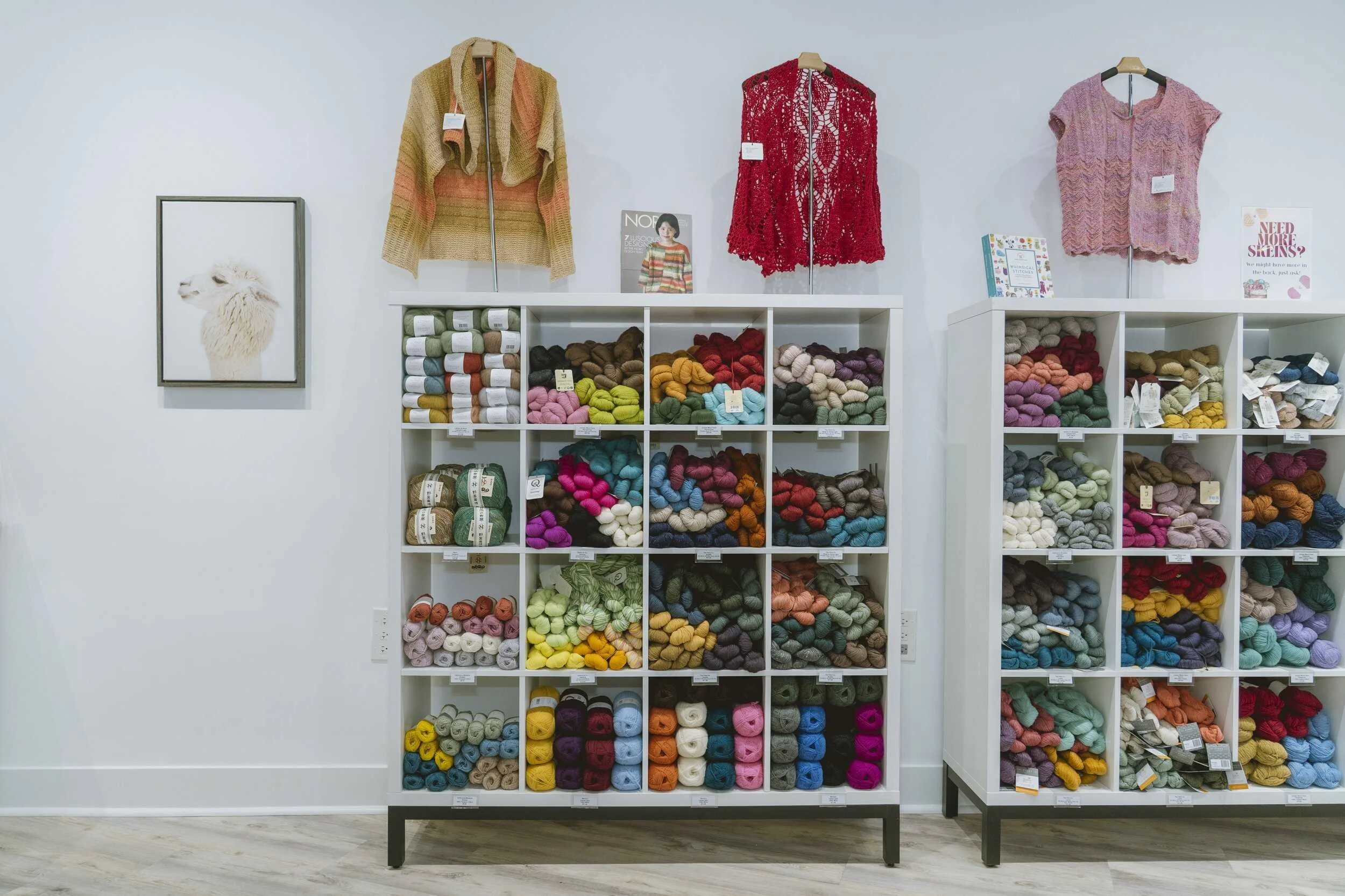 Yarn wall and knitted samples displayed at AriYARN Shop & Studio in Park Ridge, Illinois.