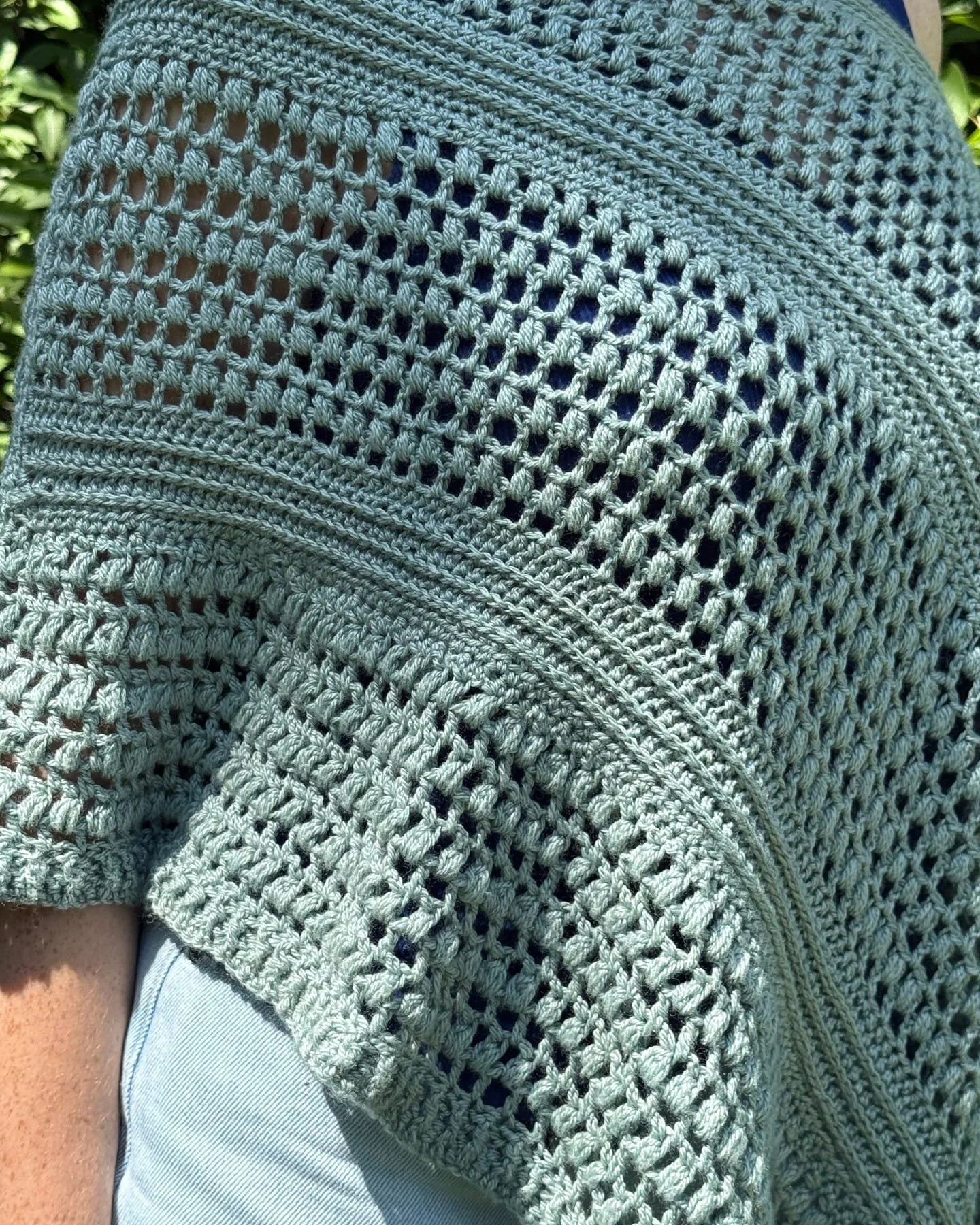 Sage green crochet mesh poncho—advanced student project from AriYARN.