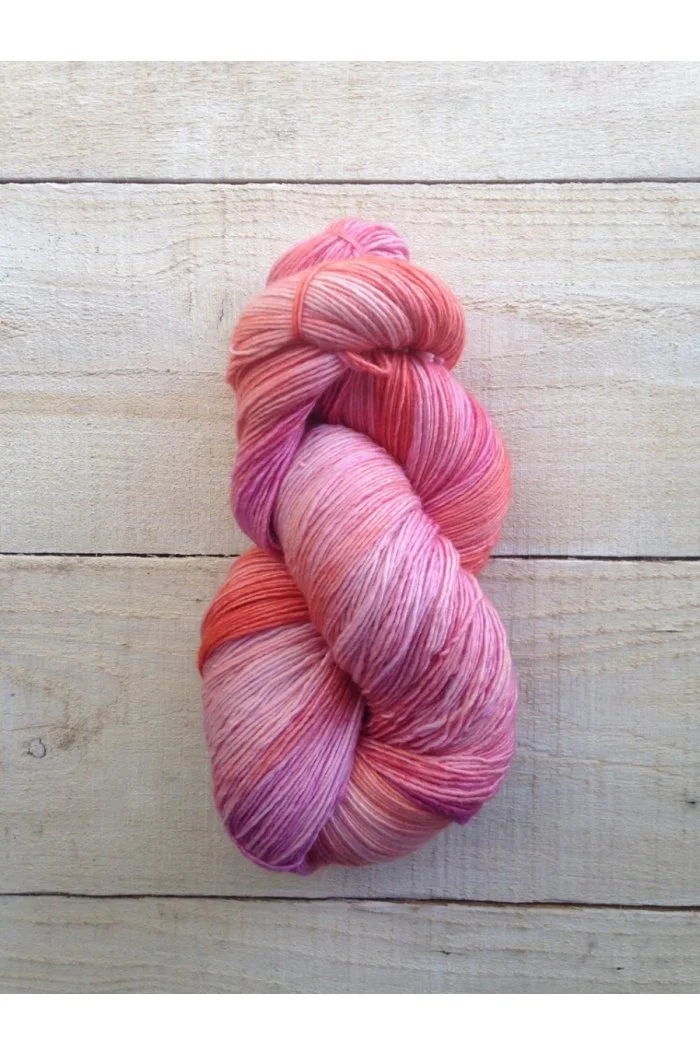 Pink and peach hand-dyed yarn skein from Manos del Uruguay