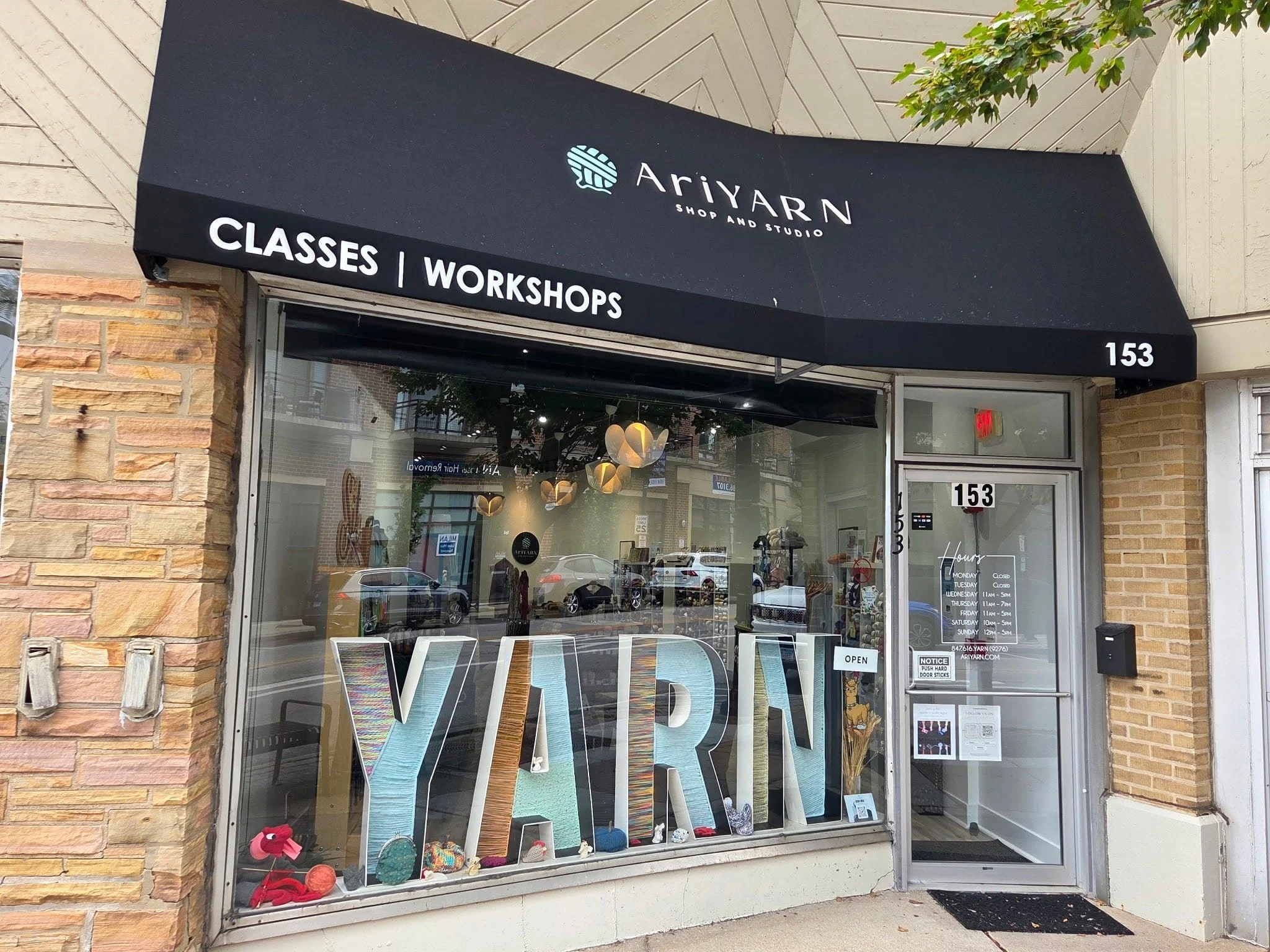 AriYARN storefront on Northwest Hwy with yarn-filled window display.