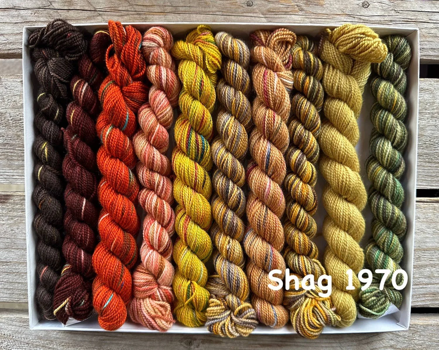 Koigu Wool Designs knitting pack with 1970s-inspired yellow and orange skeins