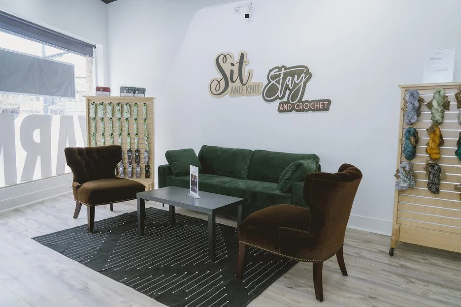 Craft lounge seating area at AriYARN Shop & Studio set up for knitting and crochet stitch night.