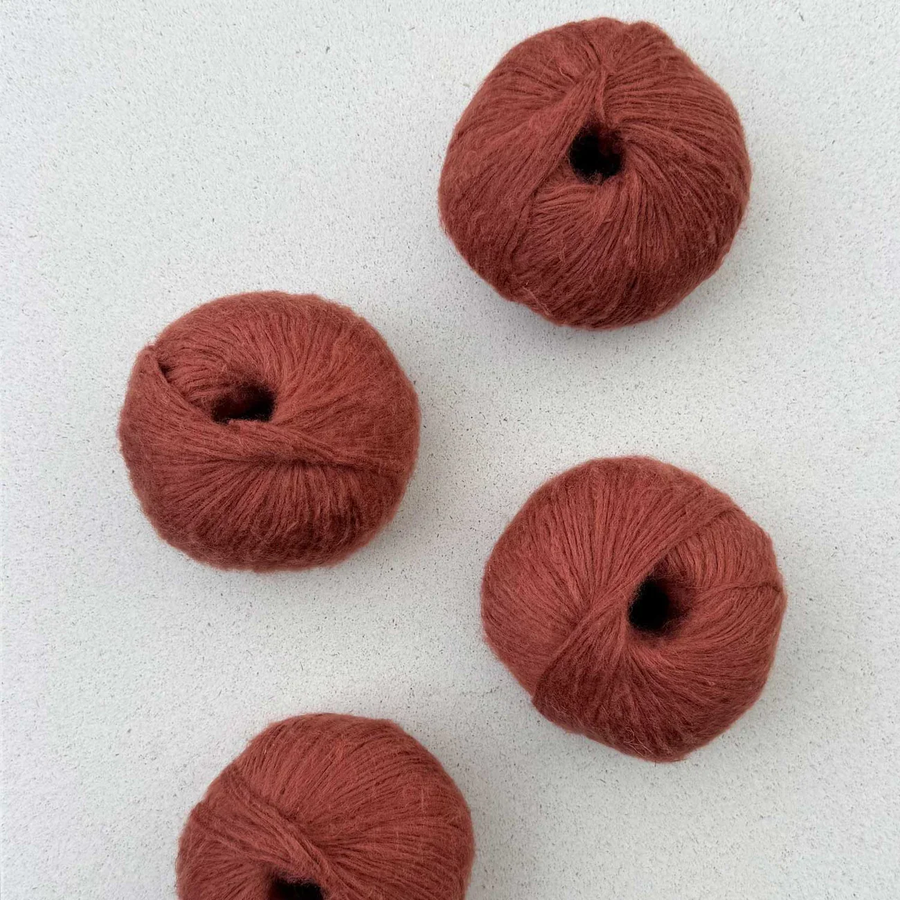 Pascuali Suave yarn in rust red, warm cozy shade