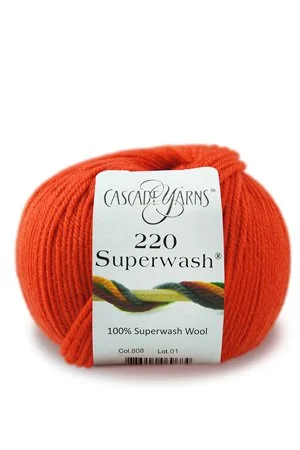 Bright orange Cascade Yarns yarn ball with a smooth finish for bold projects.