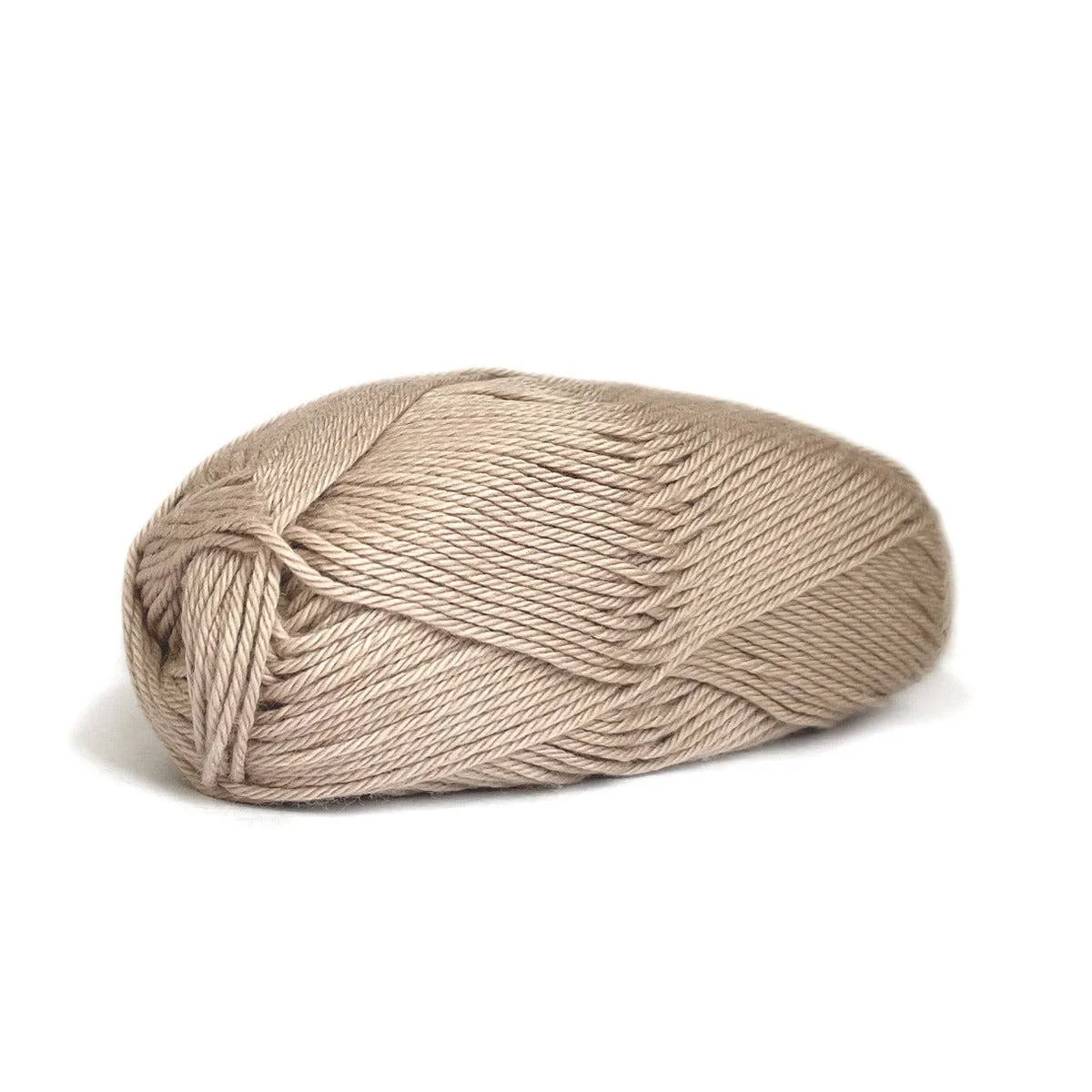 Kelbourne Woolens Skipper yarn skein in a light beige neutral tone.