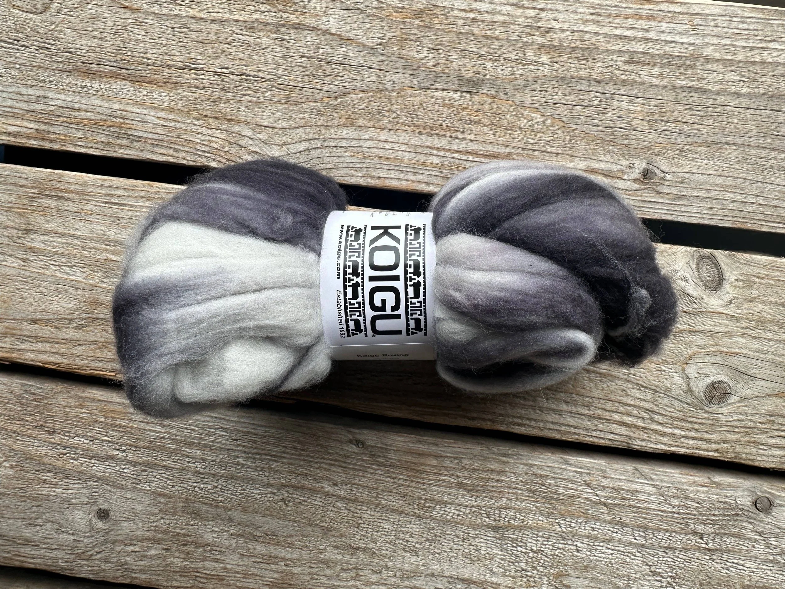 Koigu felting fiber bundle in black gray and white on wood background