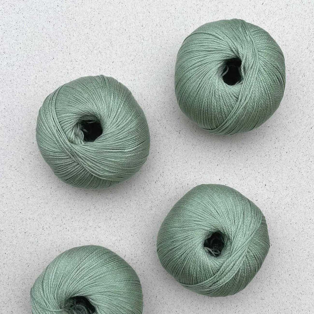 Pascuali Arctic Pearl yarn in sage green, four balls