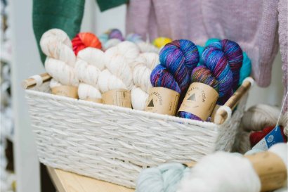 Display of hand-dyed yarn skeins at AriYARN Shop and Studio in Park Ridge