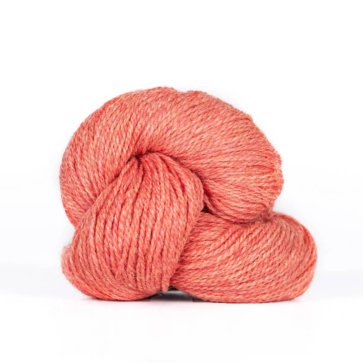 Kelbourne Woolens Camper yarn in a peach-pink shade shown as a hank closeup.