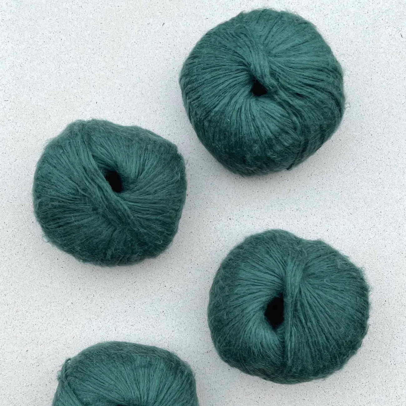 Pascuali Suave yarn in teal green, soft ball