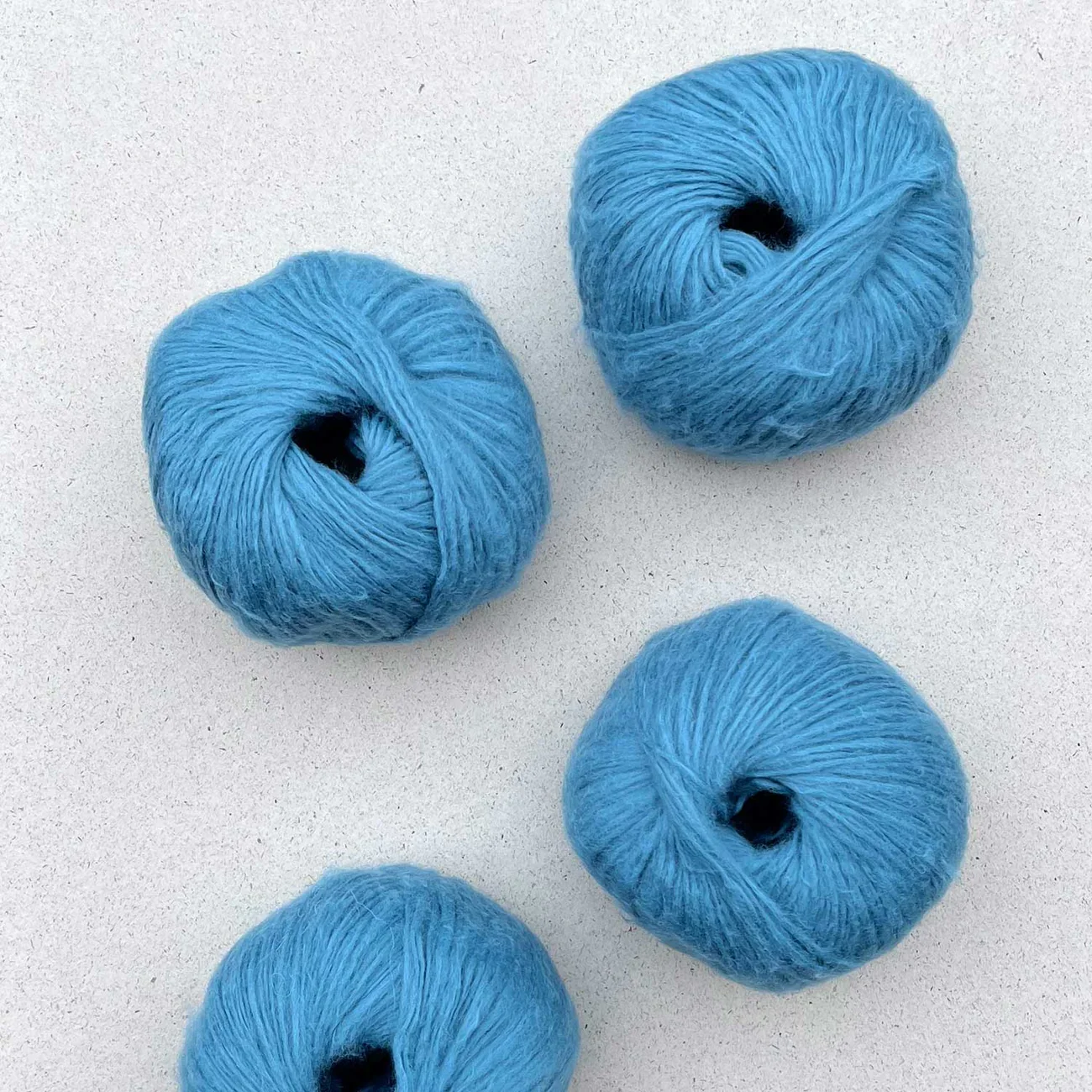 Pascuali Suave yarn in medium blue, airy chainette look