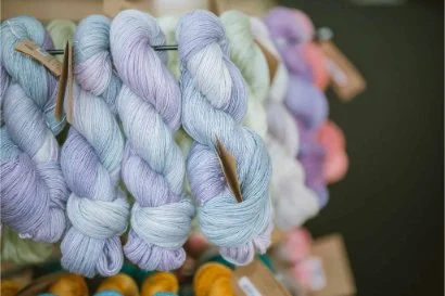 Close-up of hand-dyed yarn skeins at AriYARN near O’Hare