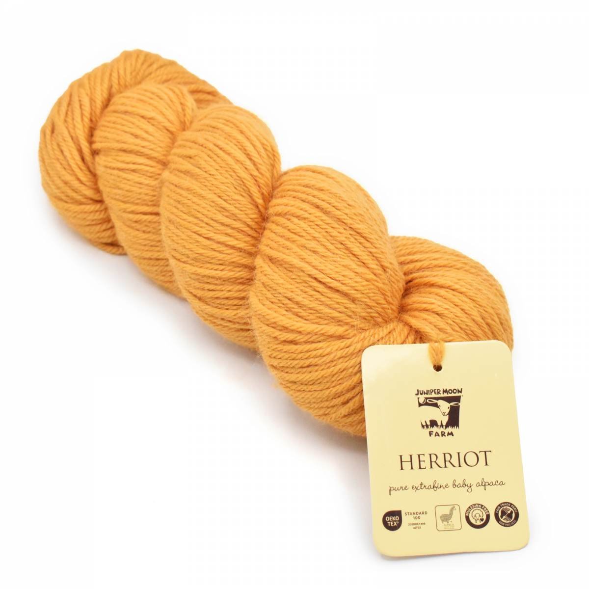 Juniper Moon Farm Herriot DK baby alpaca yarn in orange with label visible