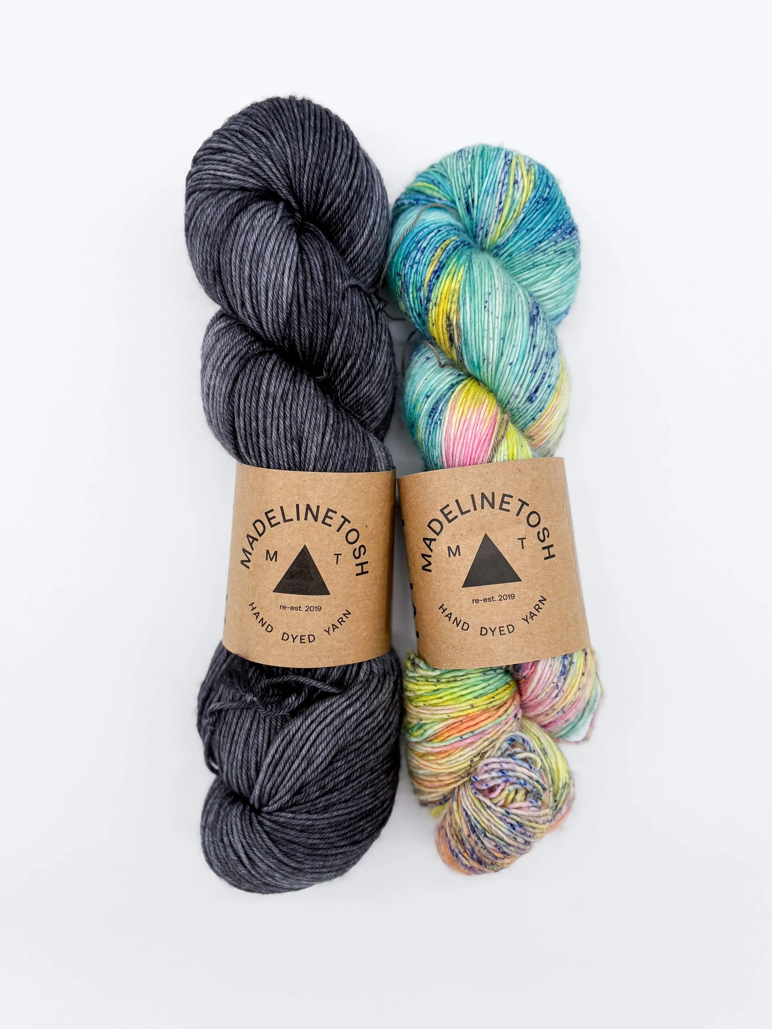 Madelinetosh-style shawl kit yarn in grey and teal tones for modern color fades