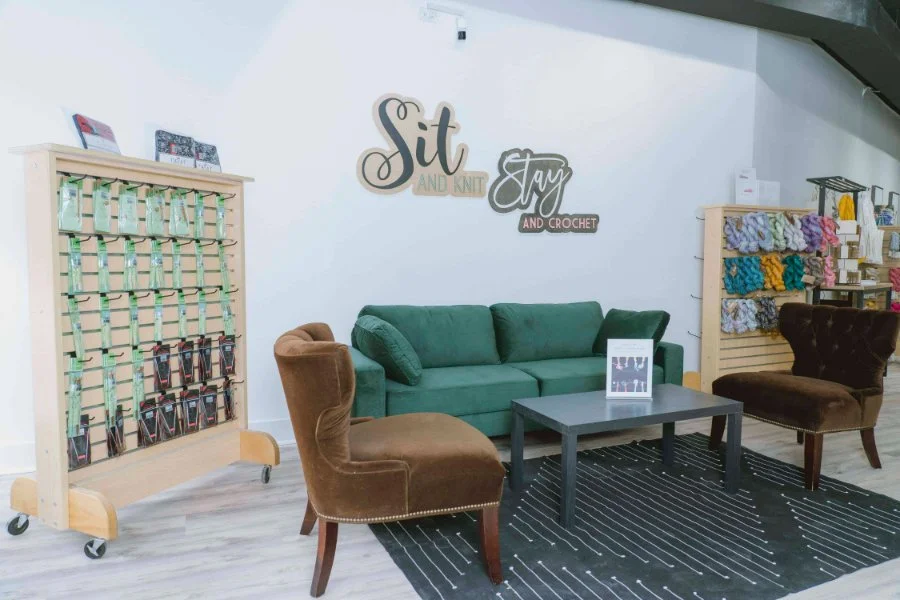 Owner and team at AriYARN Shop and Studio's bright, inviting lounge for knit and crochet in Park Ridge, IL