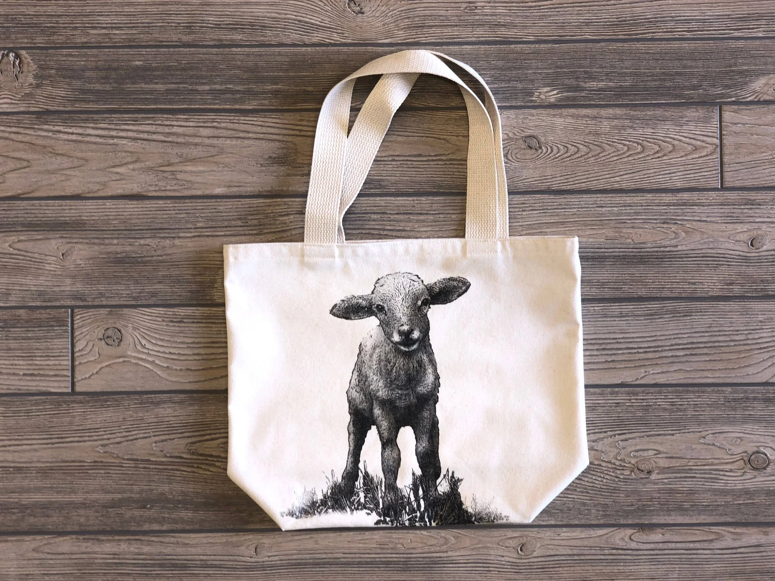 Sheep-themed yarn project bag featuring charming animal artwork