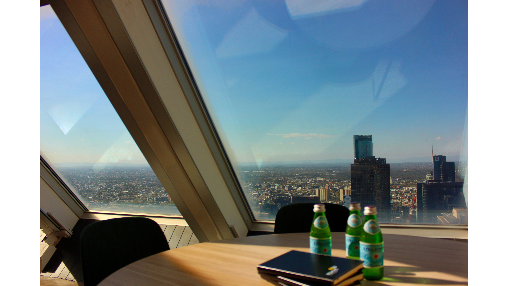 A modern IComm meeting space overlooking Melbourne.