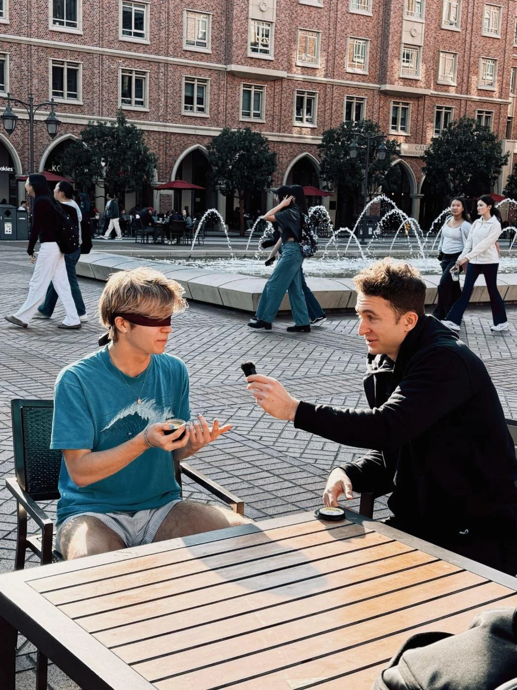 Rogue Dynamics crew filming a creator segment at an outdoor plaza