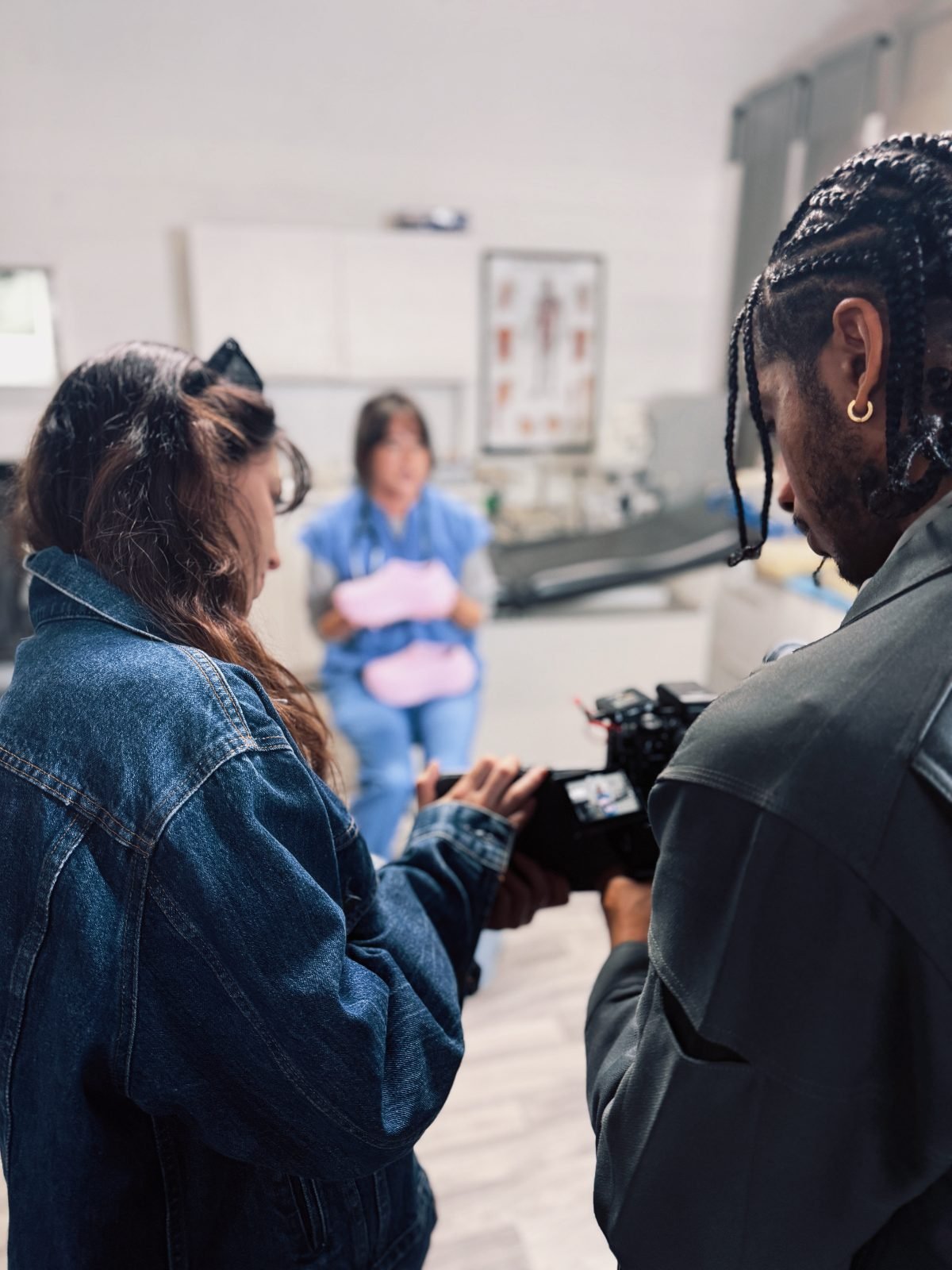 Rogue Dynamics crew reviewing a take on a healthcare shoot