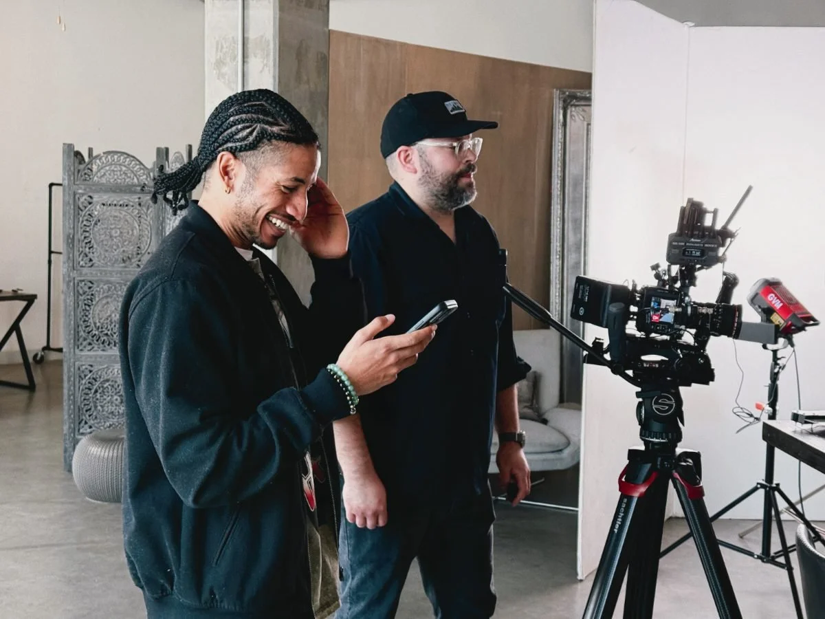 Two Rogue Dynamics team members reviewing a take on set